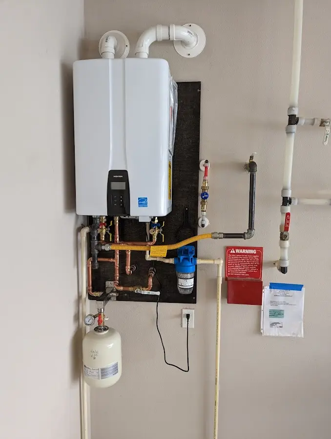 Professional plumber installing copper piping in a Beaumont home